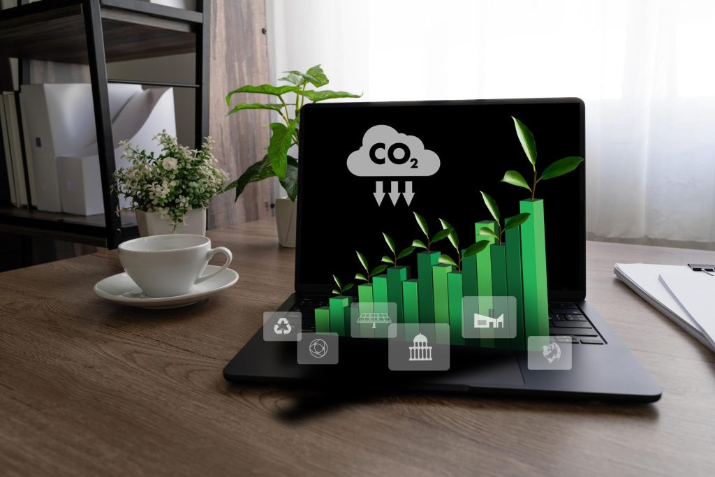 Laptop displaying green growth chart with plants symbolizing sustainability and eco-friendly business development on a desk with a coffee cup.